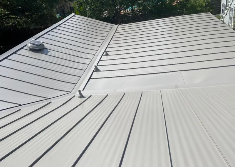 Solar attic fan installed on a metal roof for Roof Ventilation in Cascade